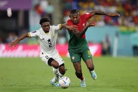 Rafael Leao of Portugal battles for possession with Tariq Lamptey of Ghana during the FIFA World Cup Qatar 2022 Group H match