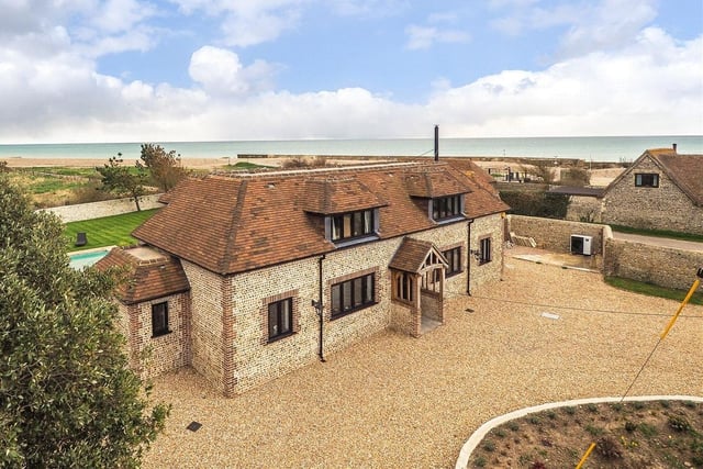 This four-bed detached house in Climping Street, Climping, boasts stunning sea views, a steam room and swimmimg pool and two Airbnb units. It is on the market with a guide price of £1.95million.