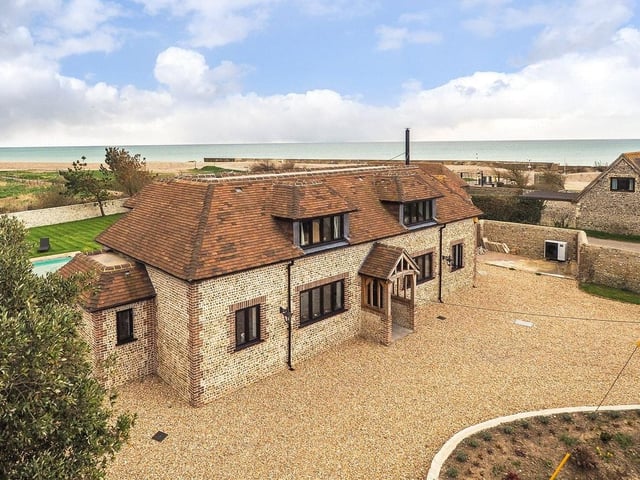 This four-bed detached house in Climping Street, Climping, boasts stunning sea views, a steam room and swimmimg pool and two Airbnb units. It is on the market with a guide price of £1.95million.