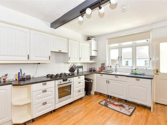 The kitchen is spacious and it gives access to a handy downstairs toilet