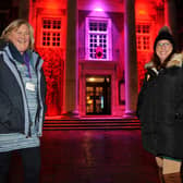 Worthing council's cabinet member for culture and leisure, Rita Garner, and Melanie Tyerman outside the illuminated Worthing Town Hall