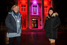 Worthing council's cabinet member for culture and leisure, Rita Garner, and Melanie Tyerman outside the illuminated Worthing Town Hall