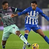 BRIGHTON, ENGLAND - DECEMBER 06: Joao Pedro of Brighton is challenged by Ethan Pinnock of Brentford during the Premier League match between Brighton & Hove Albion and Brentford FC at American Express Community Stadium on December 06, 2023 in Brighton, England. (Photo by Mike Hewitt/Getty Images)