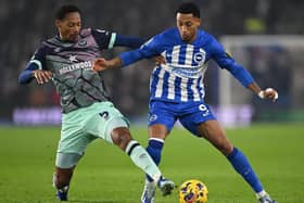 BRIGHTON, ENGLAND - DECEMBER 06: Joao Pedro of Brighton is challenged by Ethan Pinnock of Brentford during the Premier League match between Brighton & Hove Albion and Brentford FC at American Express Community Stadium on December 06, 2023 in Brighton, England. (Photo by Mike Hewitt/Getty Images)