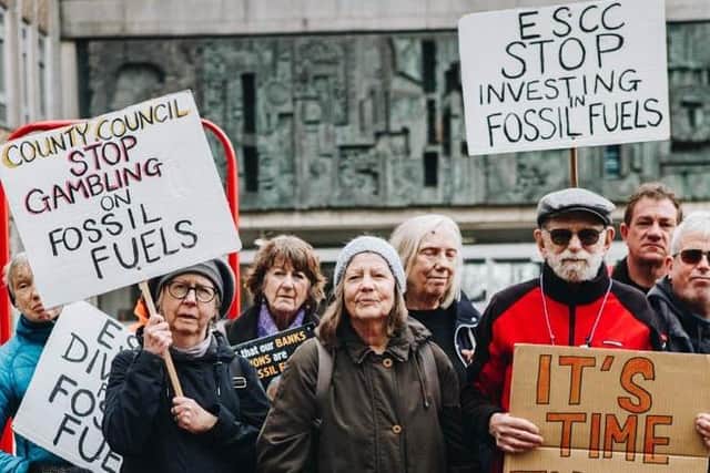 Campaigners outside County Hall prior to the hand-in of the latest Divest East Sussex petition, Tuesday 21 March 2023. 