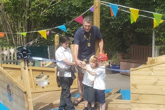 Councillor Ross officially cut the ribbon with Arlina, Jacob and Milo as the oldest and youngest at school.