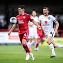 Liam Kelly in action for Crawley Town against MK Dons earlier in the season. Picture by Eva Gilbert Photography