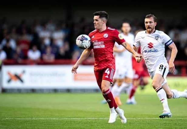 Liam Kelly in action for Crawley Town against MK Dons earlier in the season. Picture by Eva Gilbert Photography