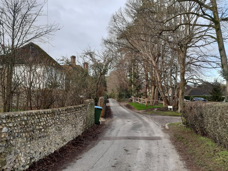 You are walking down Steep Lane towards Findon village.