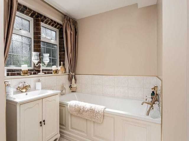 Master bedroom with en-suite and bedrooms two and three with access to en-suite bathroom - three bathrooms