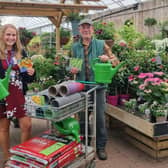 Hannah Wilson from Southway Junior School in Burgess Hill at South Downs Nurseries in Hassocks, collecting the gardening club donation from Clive Gravett, founder of the Budding Foundation. 