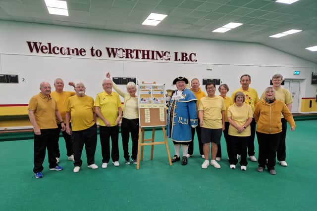 Worthing town crier Bob Smytherman with Frank Tsang and the teams before the start of the 24-hour Bowlathon at Worthing Indoor Bowls Club for BBC Children in Need. Picture: Elaine Hammond