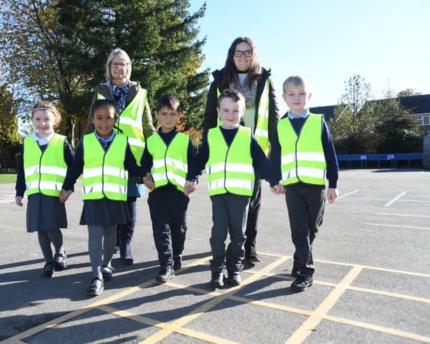 Fairway Infant School pupils and staff in their new hi-vis jackets