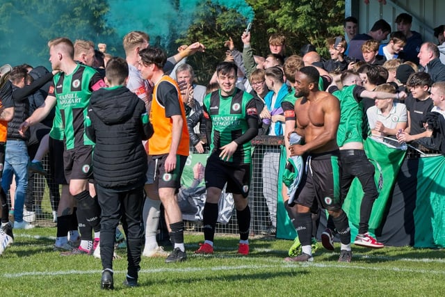 Burgess Hill Town players, fans and staff celebrate surviving in the Isthmian south east division at the end of their 0-0 draw with Beckenham
