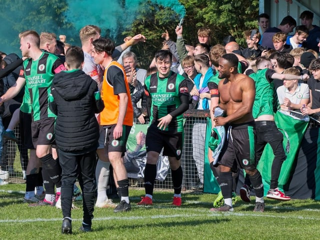 Burgess Hill Town players, fans and staff celebrate surviving in the Isthmian south east division at the end of their 0-0 draw with Beckenham