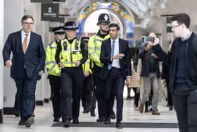 Prime Minister Rishi Sunk walks through Swan Walk shopping centre in Horsham, accompanied by local police officers. (Photo by Richard Pohle - WPA Pool/Getty Images)