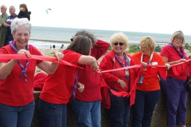 Sussex West county group formed a Sea of Red in Littlehampton as part of a region-wide celebration for Trefoil Guild's national 80th birthday