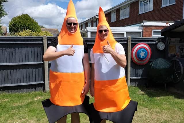 Tobey Herr and Ryan Richardson-Green are taking part in a sponsored walk dressed as traffic cones
