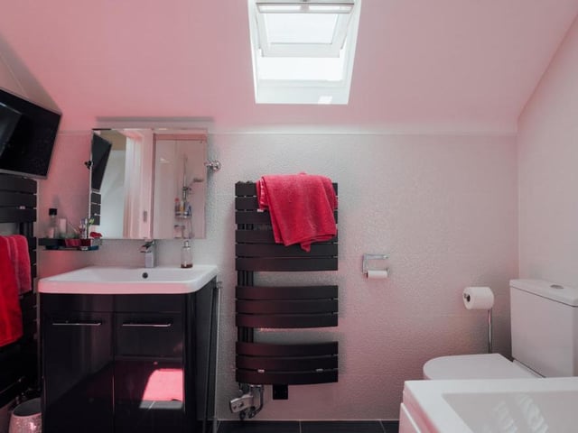 On the first floor is the main bathroom. Those contemporary touches get everywhere!