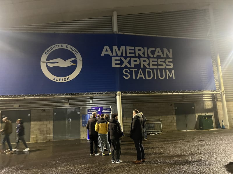 Fans grabbing some programmes before the game.