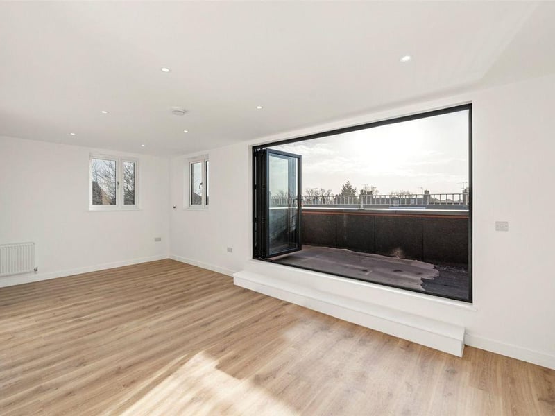 The penthouse, on the third floor, has three double bedrooms, a modern kitchen and bathroom, and south-facing terrace with views of the town and beyond