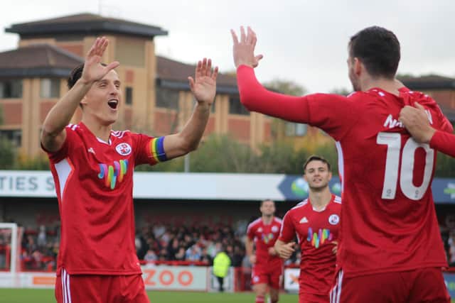 Tom Nichols celebrates a goal with Ashley Nadesan against Mansfied Town earlier in the season. Picture by Cory Pickford