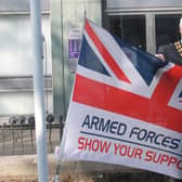 Horsham District Council chairman David Skipp raises the flag to begin Armed Forces celebrations