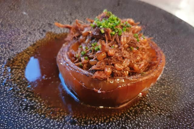 Braised Trenchmore ox cheek and heritage grains in a braised onion, beef jus