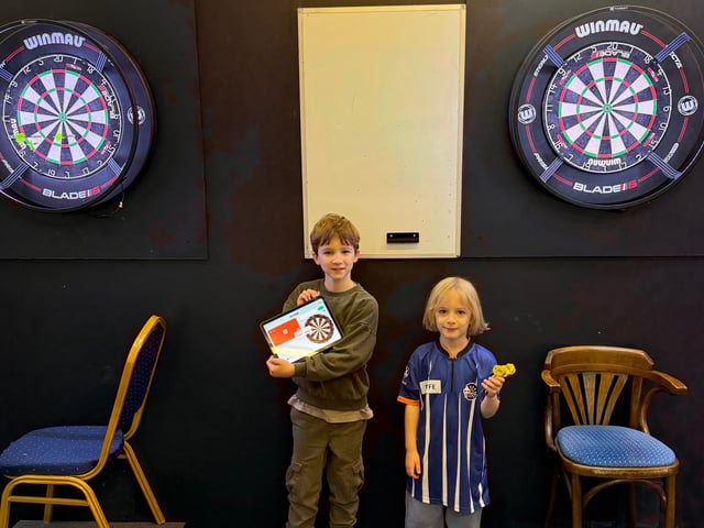 Mylo (left) and Rayfe (right organised a darts marathon in Handcross to raise money for Macmillan Cancer Support.