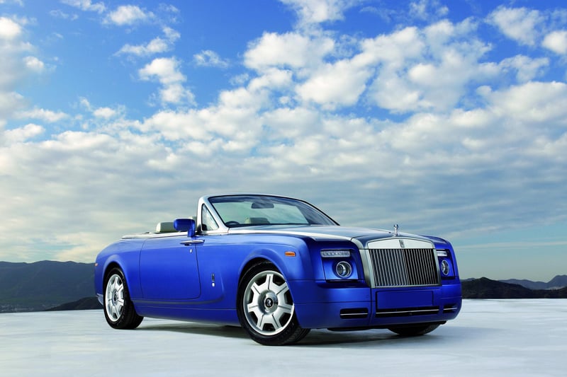 Phantom Drophead Coupé, 2007: One of the most sought-after models ever produced at Goodwood, the Phantom Drophead Coupé stunned the world on its debut. With distinctive styling derived from 100EX (see above), its defining feature is the interior wood veneering that flows around the cabin into the teak tonneau cover, inspired by a racing yacht deck.