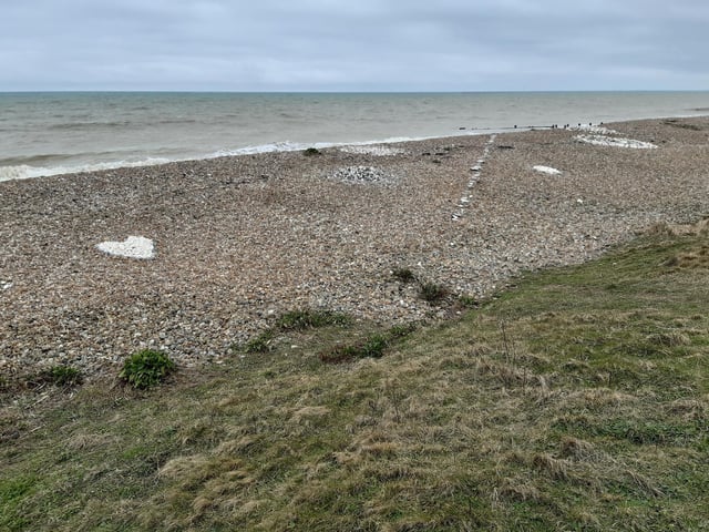 Near the bench, I saw some lovely beach art, including a big heart made of stones