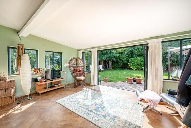 The sizeable family/garden room extension to the rear has wide aluminium bi-folding doors, overlooking the garden, bringing the outside in.