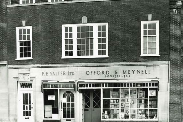 49-50 East Street, Chichester. Doorway to 49 East Street to the left of building , window and doorway of F E Salter (dry cleaners) at 49a, and Offord and Meynell at 50. Copyright of The Novium Museum (a service provided by Chichester District Council). All rights reserved.