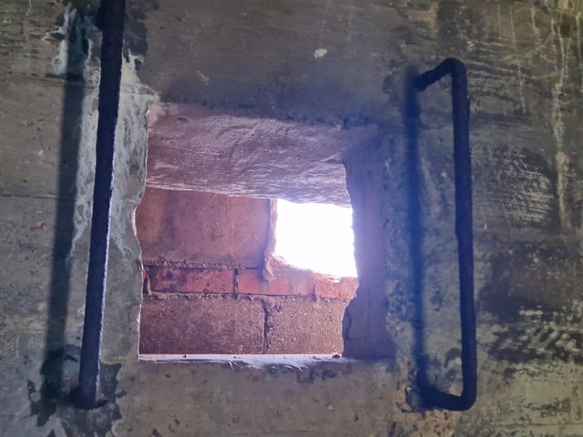 Pete Coe, one of the project leaders, and fellow former Royal Engineer Graham Cosham worked together to open the southern embrasure at the Ferring pillbox