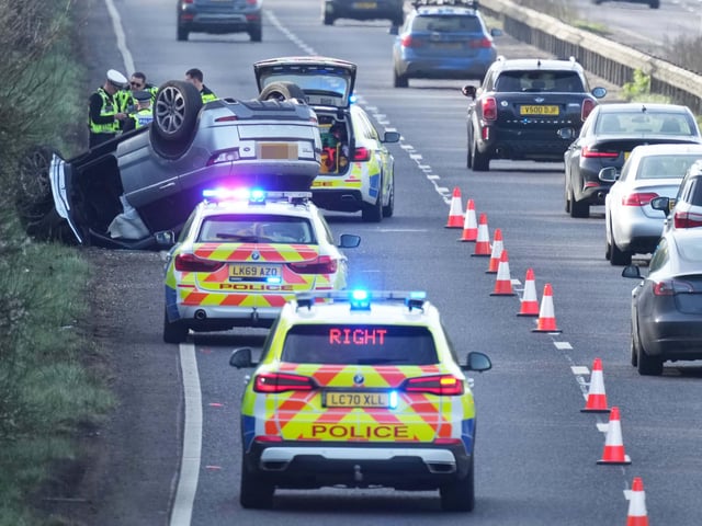 A woman has been arrested on suspicion of ‘driving while under the influence of alcohol and driving without a licence’ after overturning a vehicle on a major Sussex road.