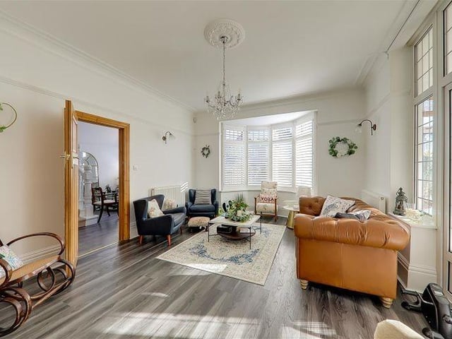 The sitting room is one of two large reception rooms