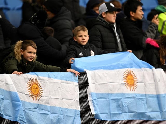 BRIGHTON, ENGLAND - JANUARY 14: Young Brighton & Hove Albion fans show their support with Argentina flags prior to the Premier League match between Brighton & Hove Albion and Liverpool FC at American Express Community Stadium on January 14, 2023 in Brighton, England. (Photo by Mike Hewitt/Getty Images)