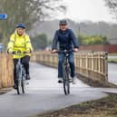 Cllr Joy Dennis, Cabinet Member for Highways and Transport and Andrew Griffith MP for Arundel and South Downs cycle part of the Findon Valley Active Travel new route.