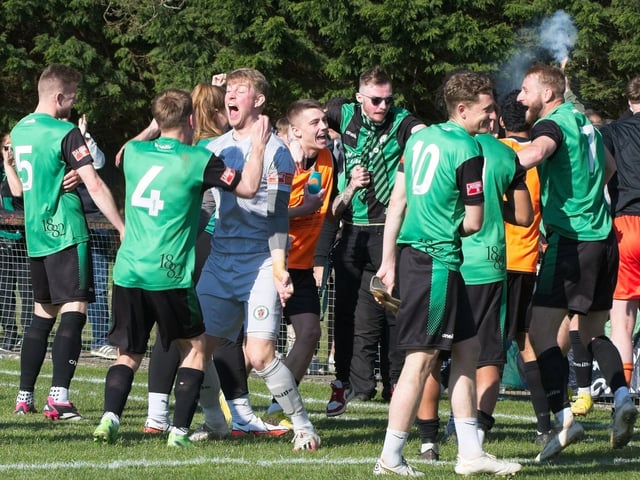Burgess Hill Town players, fans and staff celebrate surviving in the Isthmian south east division at the end of their 0-0 draw with Beckenham