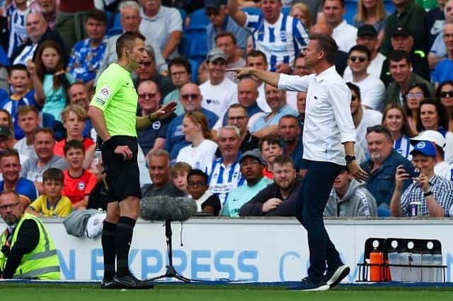 Leeds United head coach Jesse Marsch  is shown a yellow card during the Premier League defeat at Brighton