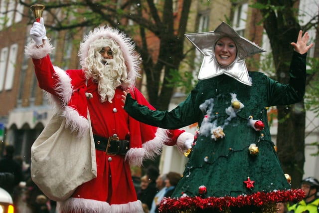 Father Christmas and his festive tree entertaining the crowds in 2008