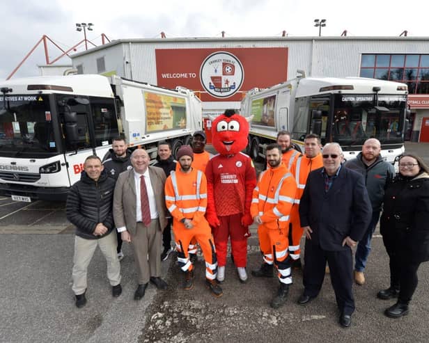 Councillor Bob Noyce, third from right, with Reggie the Red at Broadfield Stadium.