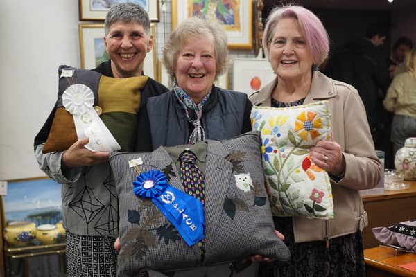 Mercedes Ferrari-Plumridge (left) and Joyce Bellingham (right) with first place winner Barbara Bradley at St Peter and St James Hospice shop in South Road, Haywards Heath