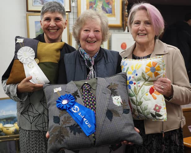 Mercedes Ferrari-Plumridge (left) and Joyce Bellingham (right) with first place winner Barbara Bradley at St Peter and St James Hospice shop in South Road, Haywards Heath