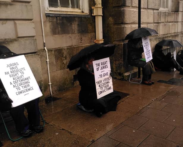 Defend Our Juries campaigners held signs outside Lewes Crown Court from 8.45am to 10am on Monday, December 4