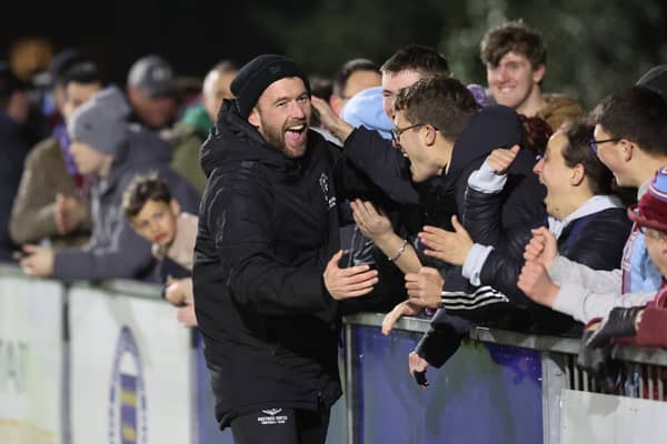 Chris Agutter ce'ebrates with fans after Hastings United beat Littlehampton Town in the semi-final of the Sussex Senior Cup | Picture: Scott White