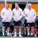 Carl Laraman (right) with Crawley Town boss Scott Lindsey (centre) and assistant manager Jamie Day (left) during the friendly with Three Bridges on Saturday. Picture: Eva Gilbert