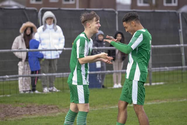 Ethan Prichard is congratulated on the first of his three goals for Chichester City at Littlehampton Town on New Year's Day | Picture: Neil Holmes