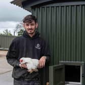 Rob McFagan and feathered friend with the world's first Shepherds Hut Chicken Coop
