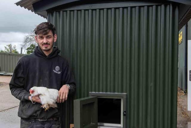 Rob McFagan and feathered friend with the world's first Shepherds Hut Chicken Coop